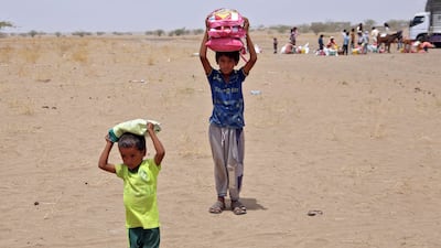 Yemenis displaced by conflict receiving food aid in Hodeidah. AFP