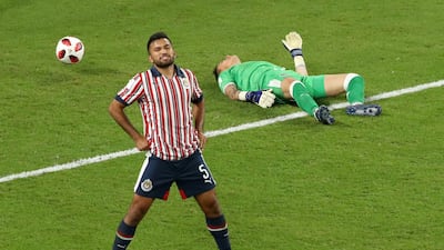 Guadalajara's Raul Gudino and Hedgardo Marin react after conceding a third goal. Reuters