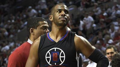 Chris Paul of the Los Angeles Clippers shown on Monday night after injuring his hand against the Portland Trail Blazers during Game 4 of their NBA first round play-offs series. Steve Dykes / Getty Images / AFP / April 25, 2016