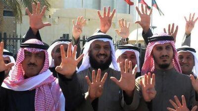 Kuwaiti opposition and former MPs (from left) Musallam Al Barrak, Falah Al Sawwagh and Bader Al Dahum outside the Palace of Justice in Kuwait City with supporters.