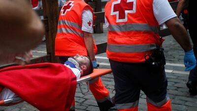 An injured runner is carried on a stretcher. Rueters