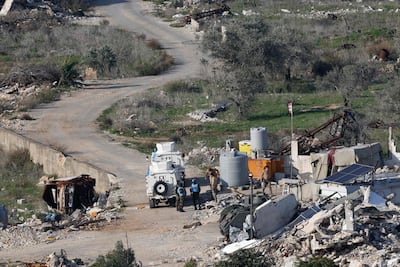 UN peacekeepers and Lebanese soldiers in a southern village struck by Israel. AFP