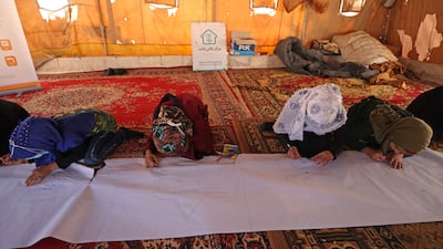 Syrian children participate in an activity orchestrated by an NGO in the village of Killi, near the Bab Al Hawa border crossing with Turkey. AFP