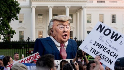 'Putin's Puppet' paraded outside the White House after Donald Trump was accused of failing to stand up to his Russian counterpart. Michael Reynolds / EPA