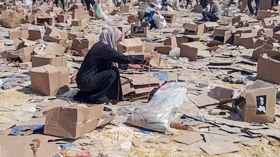 Palestinians gathered near one site in Rafah to collect what remained of relief supplies. Reuters