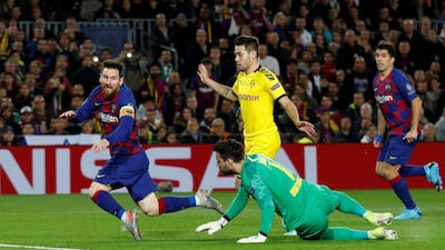 Barcelona's Lionel Messi goes down and is subsequently shown a yellow card for diving. Reuters