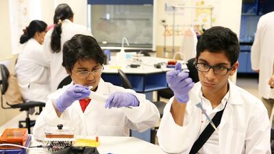 Pritvik Sinhadc, left and Jawad Asaria, right, from Dubai College conduct the experiment.