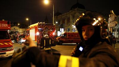 An area was cordoned off in the northern Paris suburb of Saint-Denis, close to the Stade de France, which was one of targets of suicide bombers in the coordinated attacks last week. According to reports, two people were dead and several police officers were injured. Yoan Valat / EPA