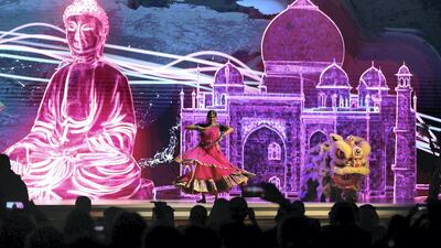 Performers show a flash of colour for arriving visitors. Pawan Singh / The National