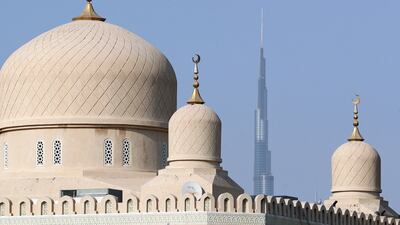 Rawda Al Abrar Mosque in the foreground at sunset. Chris Whiteoak / The National