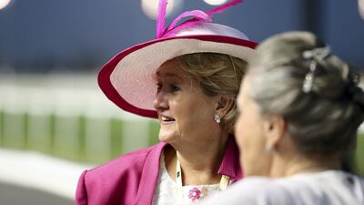 Dressed up race-goers watch the on-track action. Chris Whiteoak / The National