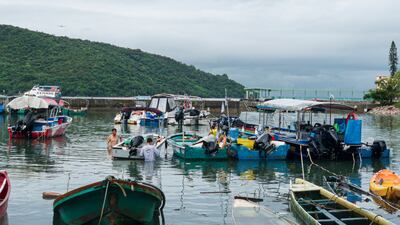 Local fishermen tie up their boats to protect them from the approaching storm, in Hong Kong. Getty Images