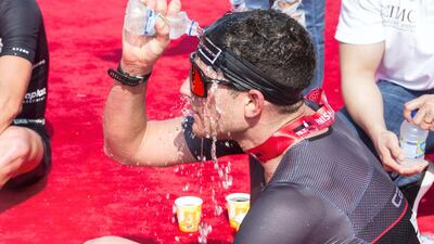 A participant cools himself off at Jumeirah beach in Dubai. Leslie Pableo for The National