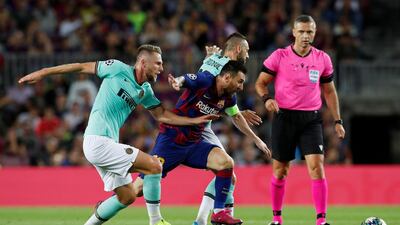 Messi in action with Inter Milan's Milan Skriniar and Marcelo Brozovic. Reuters
