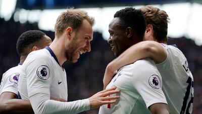 Tottenham's Victor Wanyama, centre right, celebrates with teammate Christian Eriksen after scoring against Huddersfield. EPA