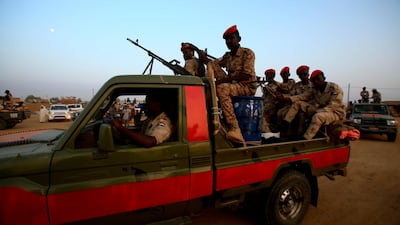 A technical (pickup truck mounted with a machine gun turret) carrying members of Sudan's Rapid Support Forces (RSF) paramilitaries drives by during a rally in the village of Qarri, about 90 kilometres north of Khartoum. AFP