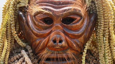 Indigenous Mah Meri tribesman wears a wooden mask during a thanksgiving ritual called "Puja Pantai" in Carey Island, outside Kuala Lumpur, Malaysia. Sadiq Asyraf / AP Photo