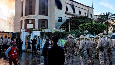 Paramedics and security officers at the scene of an attack outside the Libyan foreign ministry headquarters in the capital Tripoli. AFP