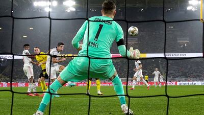 Dortmund goalkeeper Gregor Kobel cannot stop Robert Lewandowski opening the scoring.