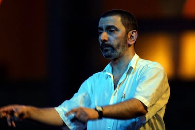 Ziad Rahbani conducts the orchestra for Fairuz during her 2001 Beiteddine Festival residency in Lebanon. AFP