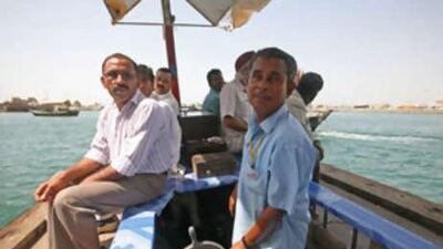 Noor Hussain steers his abra across Dubai Creek.