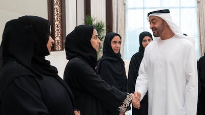Sheikh Mohamed bin Zayed greets a member of the Ministry of Presidential Affairs, during an iftar reception, at Abu Dhabi's Al Bateen Palace.