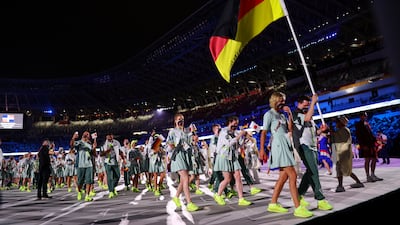 Patrick Hausding and Laura Ludwig, of Germany, lead their contingent during the athletes parade at the opening ceremony.