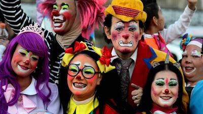 Clowns pose for the camera. AFP