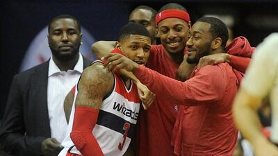 Paul Pierce, centre, celebrates with Bradley Beal, left, and John Wall, right, during the Washington Wizards' Game 4 win over the Toronto Raptors on Sunday night. Greg Fiume / Getty Images / AFP / April 26, 2015
