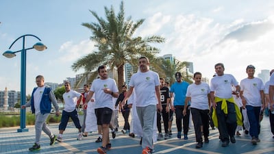 The Minister for Foreign Affairs reaches the end of the seven kilometre walk along the Abu Dhabi corniche.