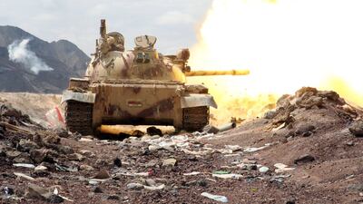 Armed Yemeni tribesmen from the Popular Resistance Committees fire a round from a tank in Sirwah, west of Marib city. Abdullaj Al Qadry / AFP Photo