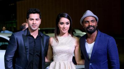 Remo D’Souza dancer, choreographer, actor and film director, with actress Shraddha Kapoor and actor Varun Dhawan on the golden carpe. Ravindranath K / The National