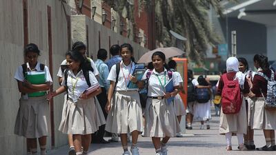 Pupils at Indian High School on Oud Mehta Road in Dubai return to class on Sunday. Satish Kumar / The National
