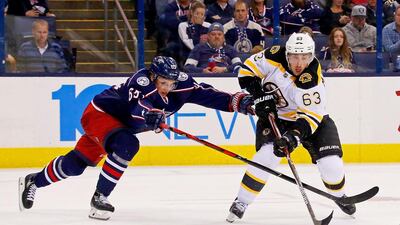 Markus Nutivaara of the Columbus Blue Jackets attempts to knock the puck away from Brad Marchand of the Boston Bruins on October 13, 2016 at Nationwide Arena in Columbus, Ohio. Boston defeated Columbus 6-3. Kirk Irwin / Getty Images