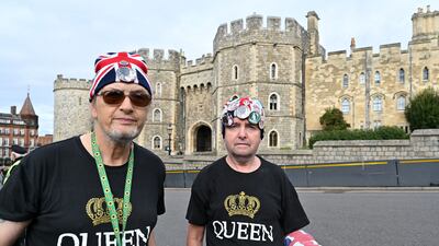 Royal enthusiasts Sky London and John Lowry outside Windsor Castle on Thursday. AFP