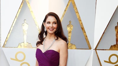 BOLD COLOURS: Ashley Judd opted for an intense purple gown, with a strapless bodice and plain skirt. Deceptively simple, the gown let Judd’s impressive diamond jewellery take the limelight. EPA