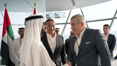 Sheikh Mohammed bin Rashid, Vice President and Ruler of Dubai (L) greets Calin Popescu-Tariceuanu President of the Senate of Romania (R), on the final day of the 2018 Formula 1 Etihad Airways Abu Dhabi Grand Prix, in Shams Tower. Ryan Carter / Ministry of Presidential Affairs