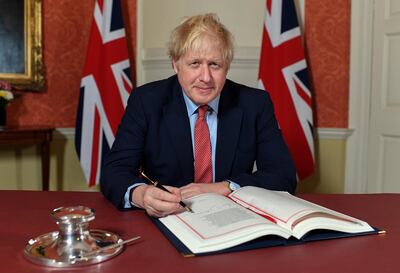 UK Prime Minister Boris Johnson signs the Brexit Withdrawal Agreement.