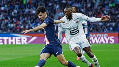 PSG's Vitinha in action with Stade Rennes' Karl Toko-Ekambi. Reuters