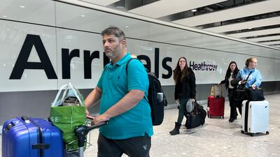 Passengers arriving at Heathrow in London after the airport reopened. PA Wire