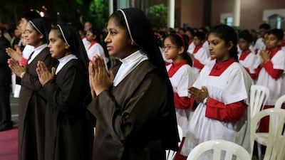 Nuns pray during Christmas Eve mass. Christopher Pike / The National
