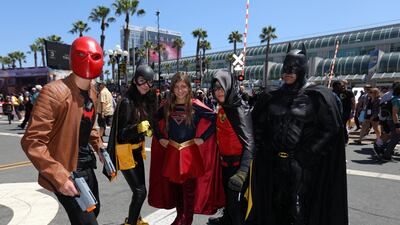 Attendees pose for a picture outside Comic Con International in San Diego. Mike Blake / Reuters