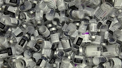 Empty vials of vaccines by Pfizer-BioNTech and AstraZeneca are pictured at the vaccination center in Rosenheim. AFP
