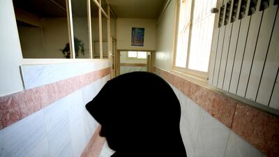 A female prison guard stands along a corridor in Tehran's Evin prison in 2006. Reuters