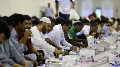 People break their fast at the Sheikh Zayed Grand Mosque in Abu Dhabi during Ramadan last year. Pawan Singh / The National