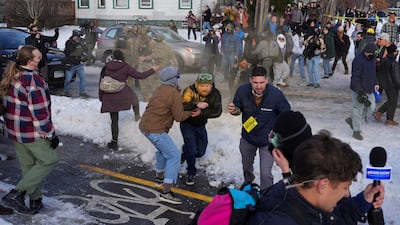 Border Patrol agents use chemical irritants to disperse a crowd at the scene of the shooting. Reuters