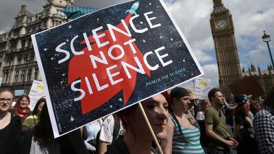 A protestor holds a placard as scientists and science enthusiasts participate in the 'March for Science' which celebrates the scientific method in Westminster, central London. Daniel Leal-Olivas / AFP