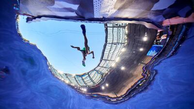 An athlete clears the water jump during the men's 3000-metre steeplechase at the Olympic Games in Paris. AP