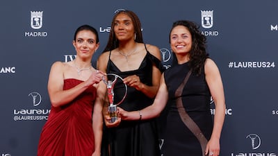 Spain's women's national team players Aitana Bonmati, left, Salma Paralluelo, centre, and Ivana Andres pose for photographers after receiving the 2024 Laureus award for best team. EPA