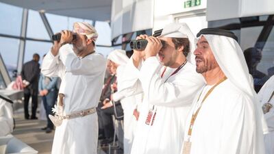 Sheikh Suroor bin Mohamed (R), Sheikh Mansour bin Zayed Deputy Prime Minister and Minister of Presidential Affairs (2nd R), and others attend the final race of the Formula 1 Etihad Airways Abu Dhabi Grand Prix at Yas Marina Circuit. Mohamed Al Hammadi / Crown Prince Court - Abu Dhabi